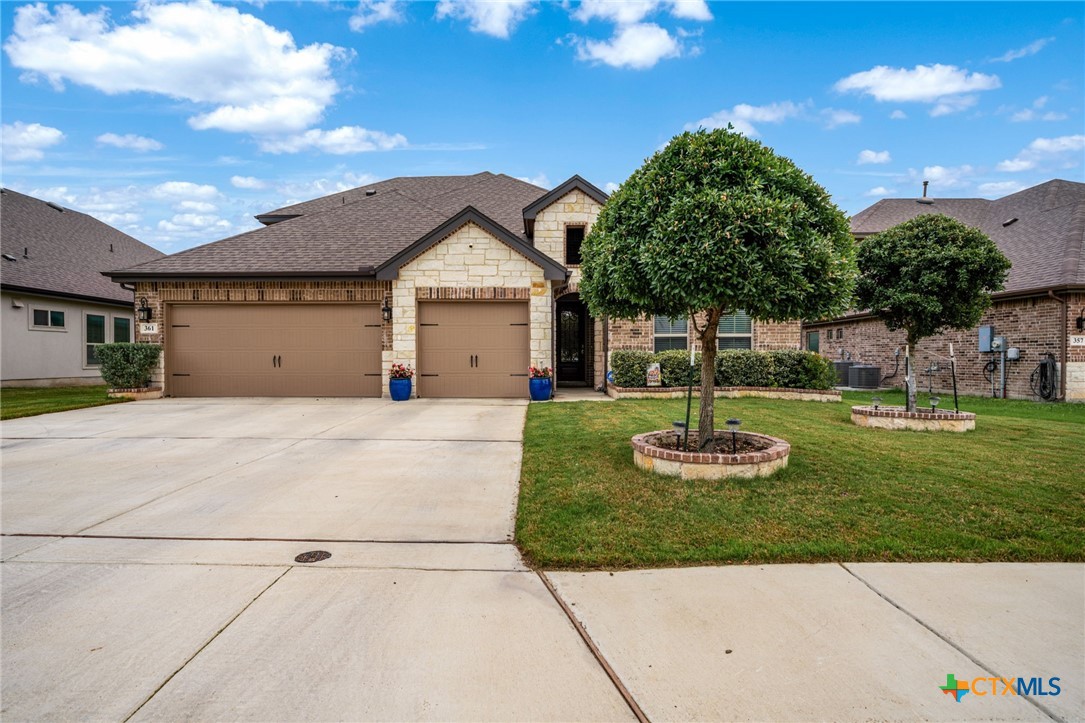 361 Misty Sails Cibolo, TX 78108 - Photo 2 of 48 a front view of a house with garden
