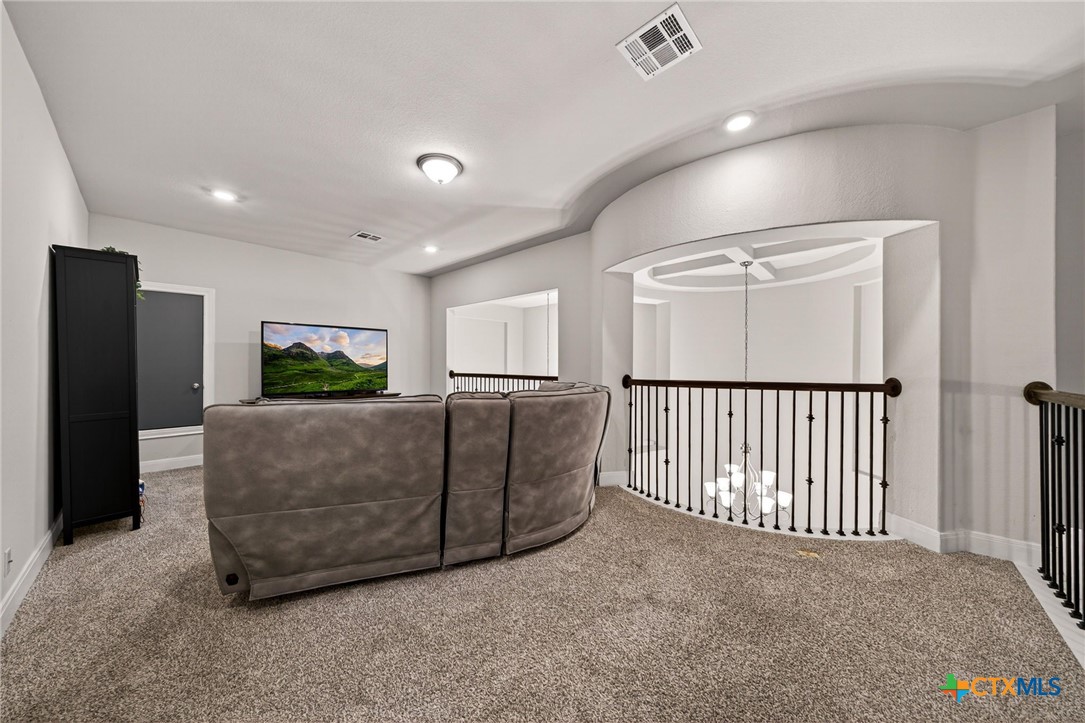 361 Misty Sails Cibolo, TX 78108 - Photo 30 of 48 a living room with furniture a flat screen tv and a refrigerator