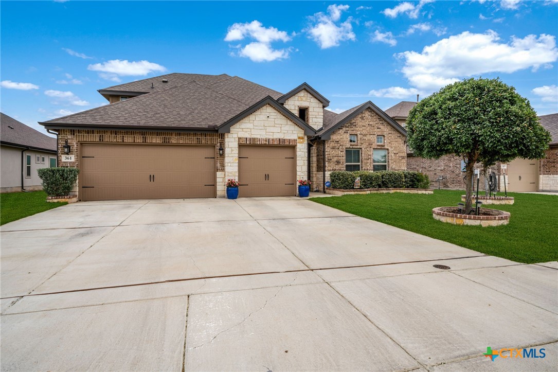 361 Misty Sails Cibolo, TX 78108 - Photo 3 of 48 a front view of a house with yard and green space