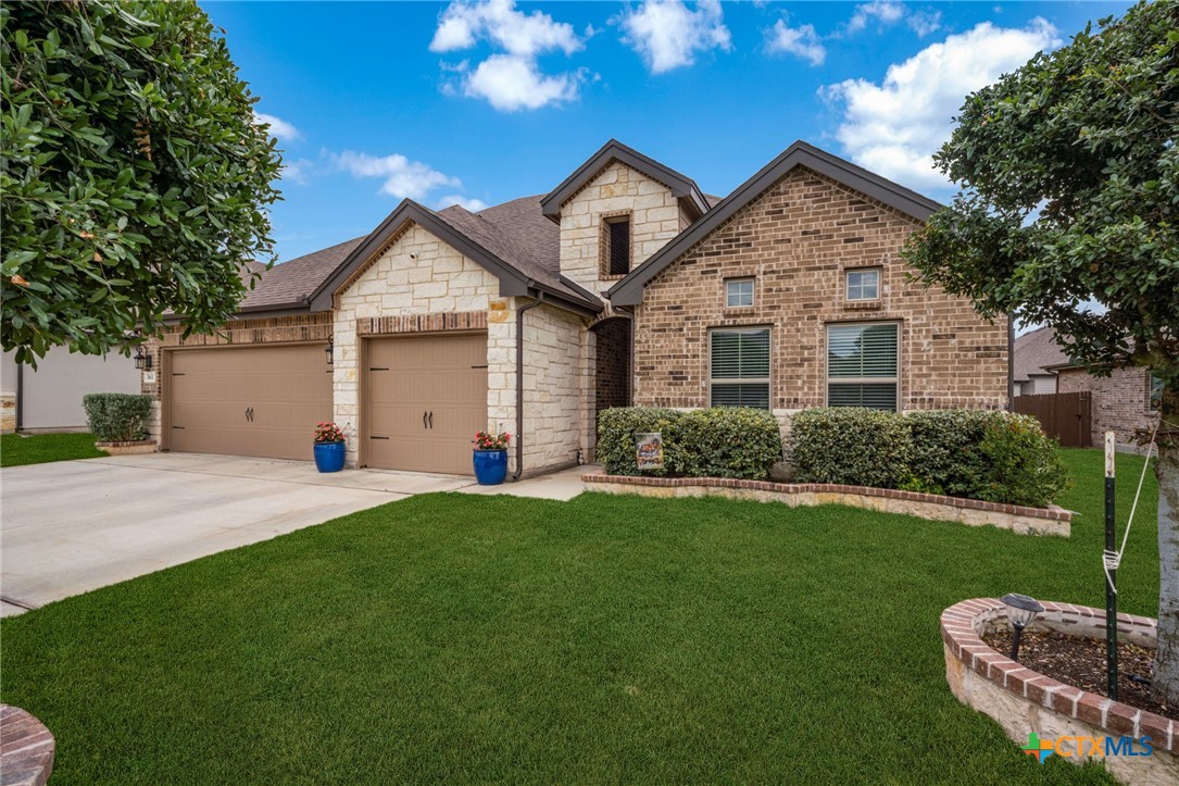 361 Misty Sails Cibolo, TX 78108 - Photo 4 of 48 a front view of a house with a yard and garage