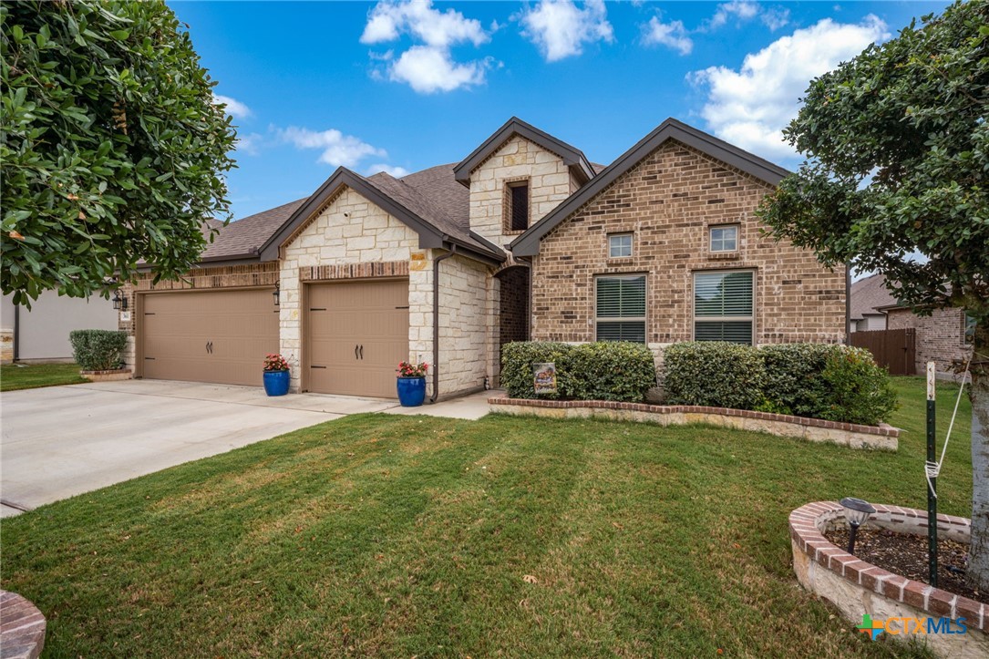 361 Misty Sails Cibolo, TX 78108 - Photo 5 of 48 a front view of a house with a garden