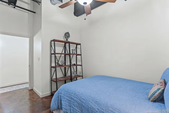 a bedroom with a bed and window