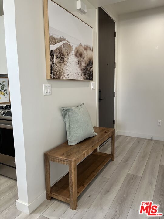 124 South Croft Avenue, Unit 403 Los Angeles, CA 90048 - Photo 12 of 31 a living room with furniture and wall paintings