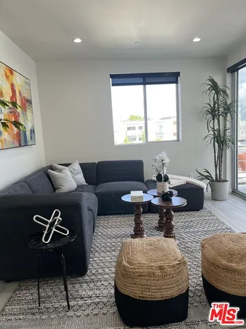 a living room with furniture or couch and a window