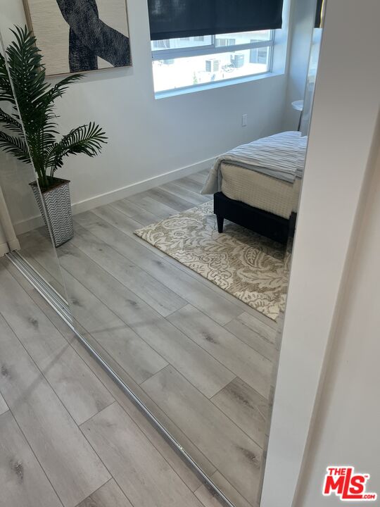 124 South Croft Avenue, Unit 403 Los Angeles, CA 90048 - Photo 2 of 31 a bathroom with a sink and a mirror