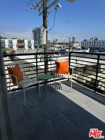 a view of a chairs and table in the terrace