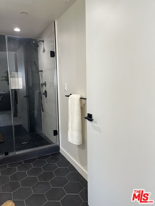 124 South Croft Avenue, Unit 403 Los Angeles, CA 90048 - Photo 9 of 31 a bathroom with a shower and a sink