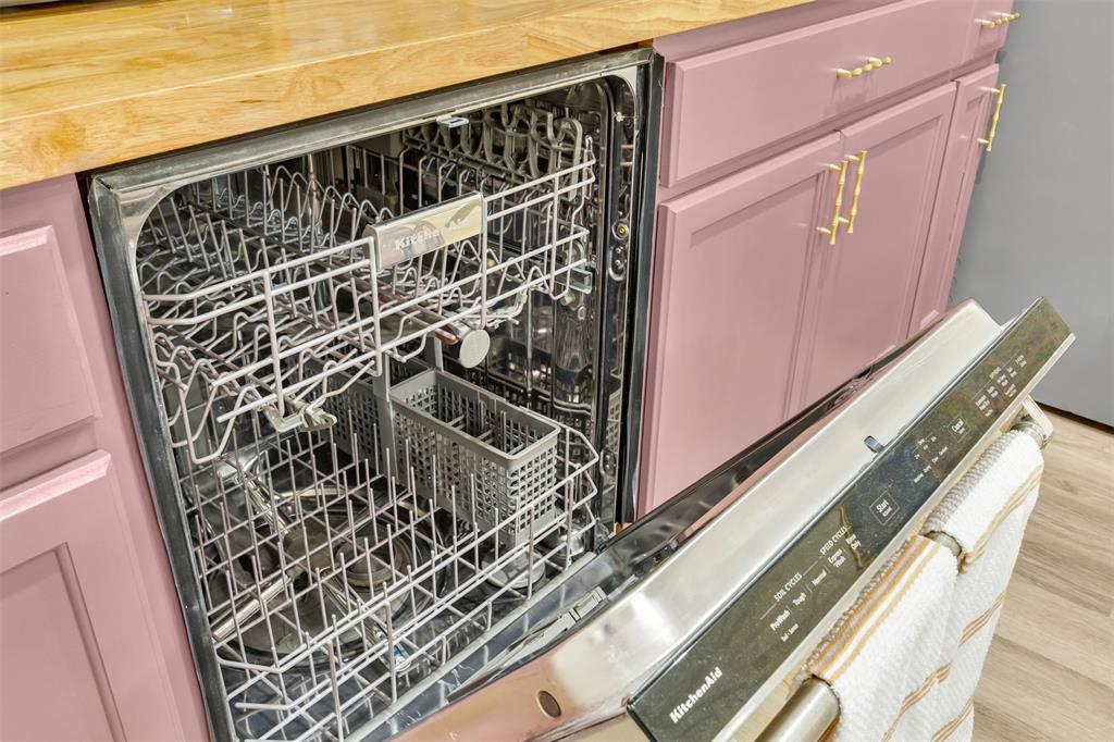 4121 Junius Street, Unit B Dallas, TX 75246 - Photo 30 of 32 Stainless steel dishwasher with visible interior racks
