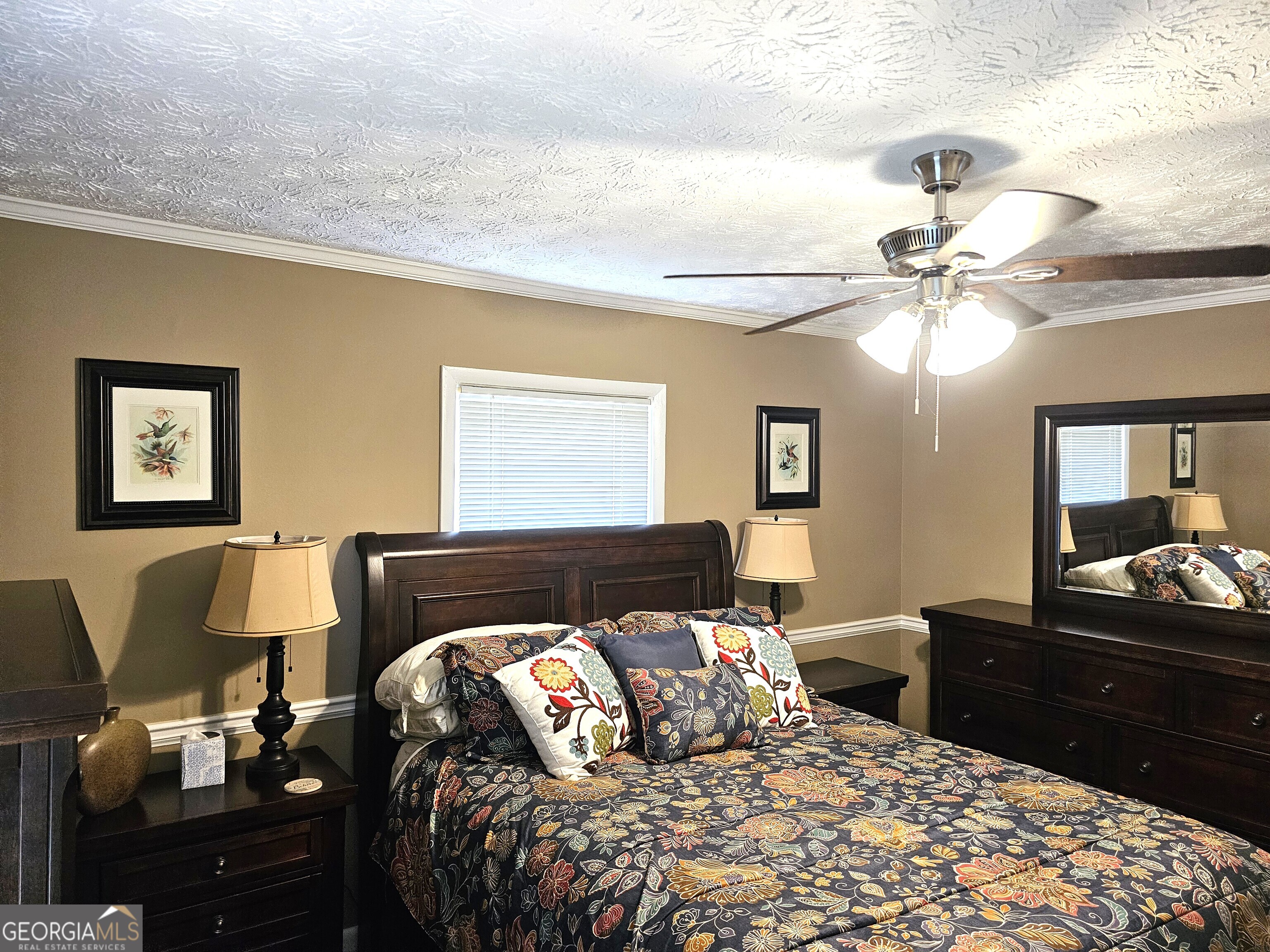 1853 Highway 441 Dublin, GA 31021 - Photo 16 of 28 a bedroom with a bed and wooden floor