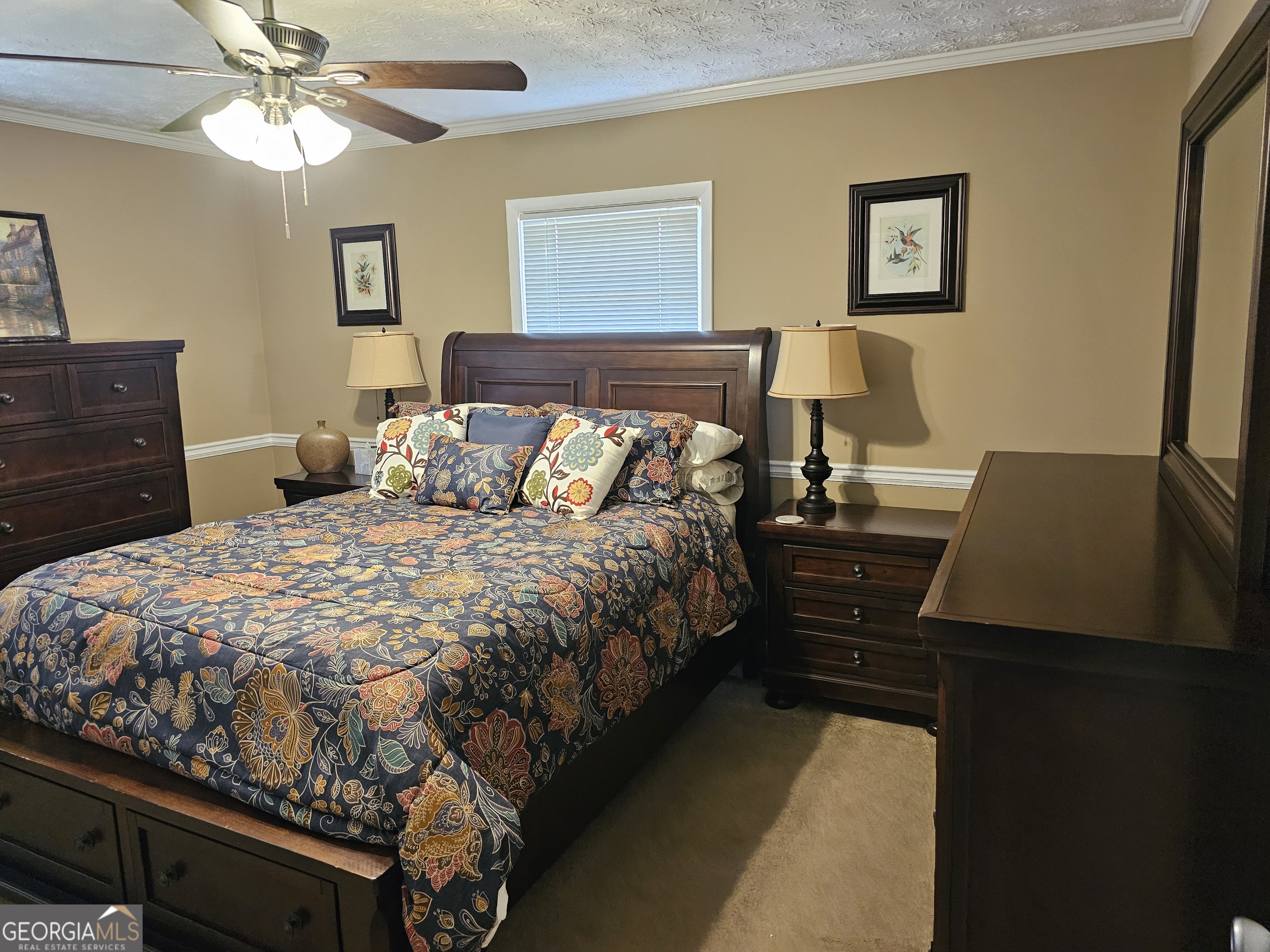 1853 Highway 441 Dublin, GA 31021 - Photo 17 of 28 a bedroom with a bed and a lamp on dresser