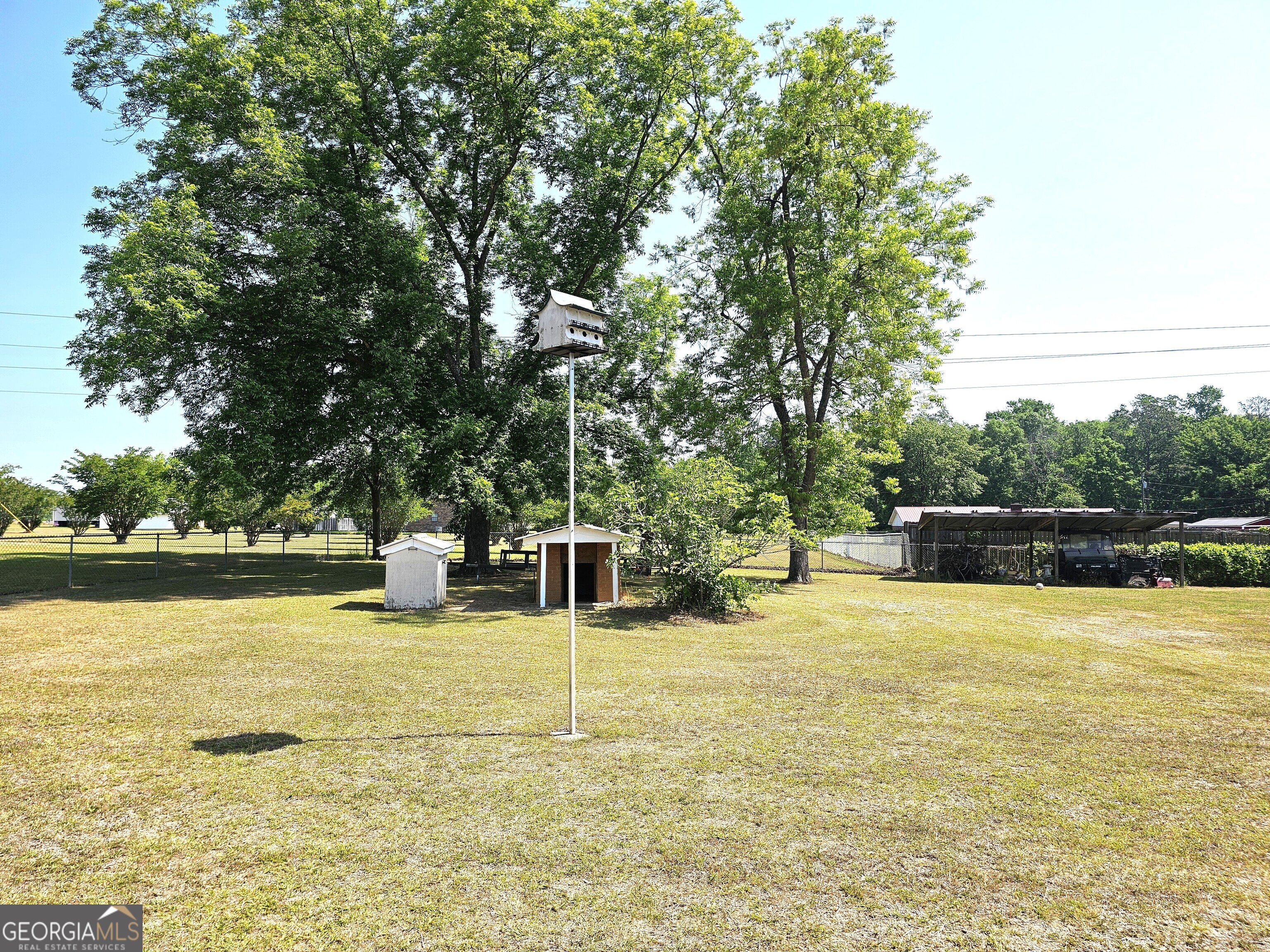 1853 Highway 441 Dublin, GA 31021 - Photo 27 of 28 a view of a swimming pool with an outdoor space and seating area