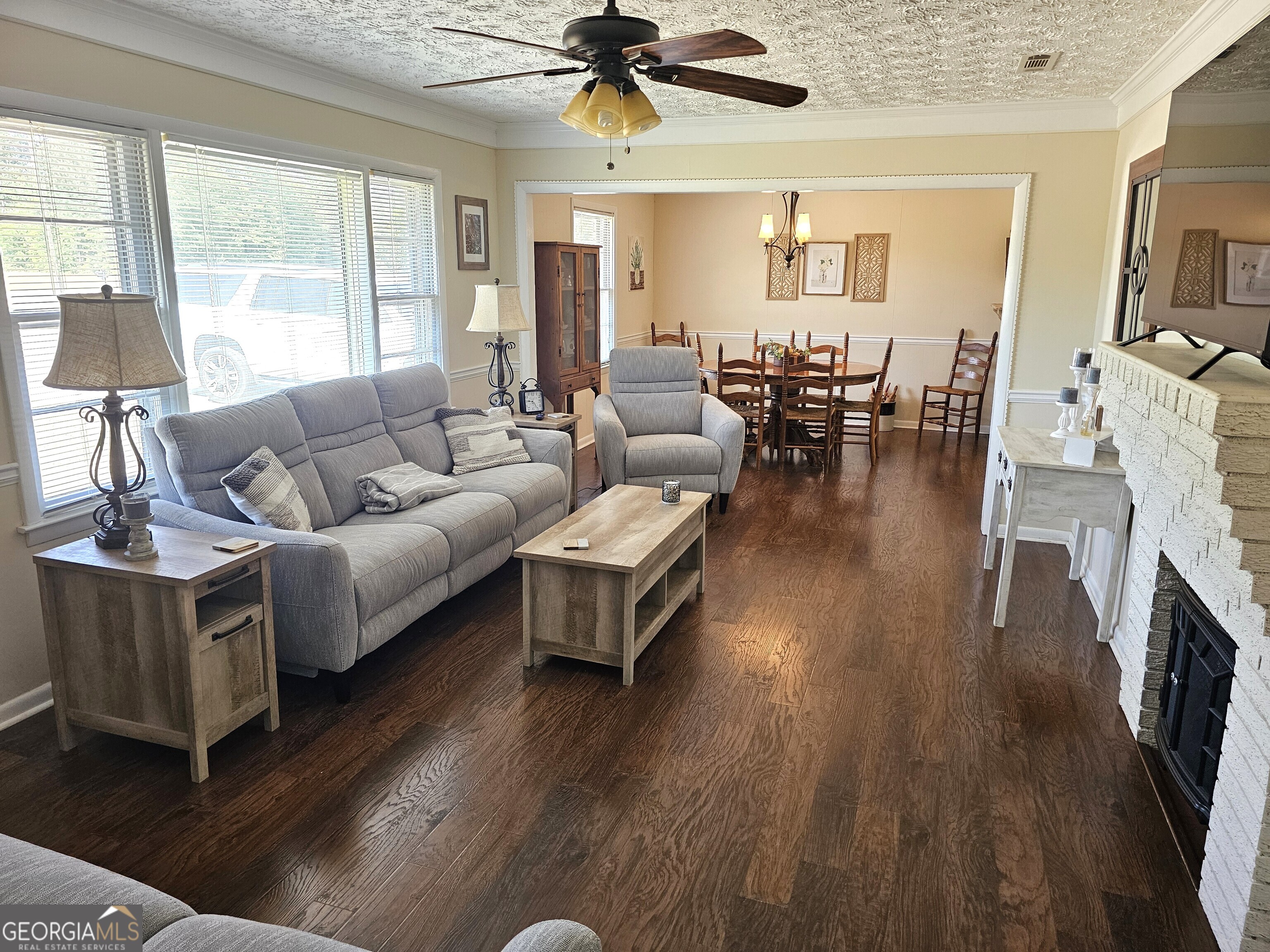 1853 Highway 441 Dublin, GA 31021 - Photo 4 of 28 a living room with fireplace furniture and a wooden floor