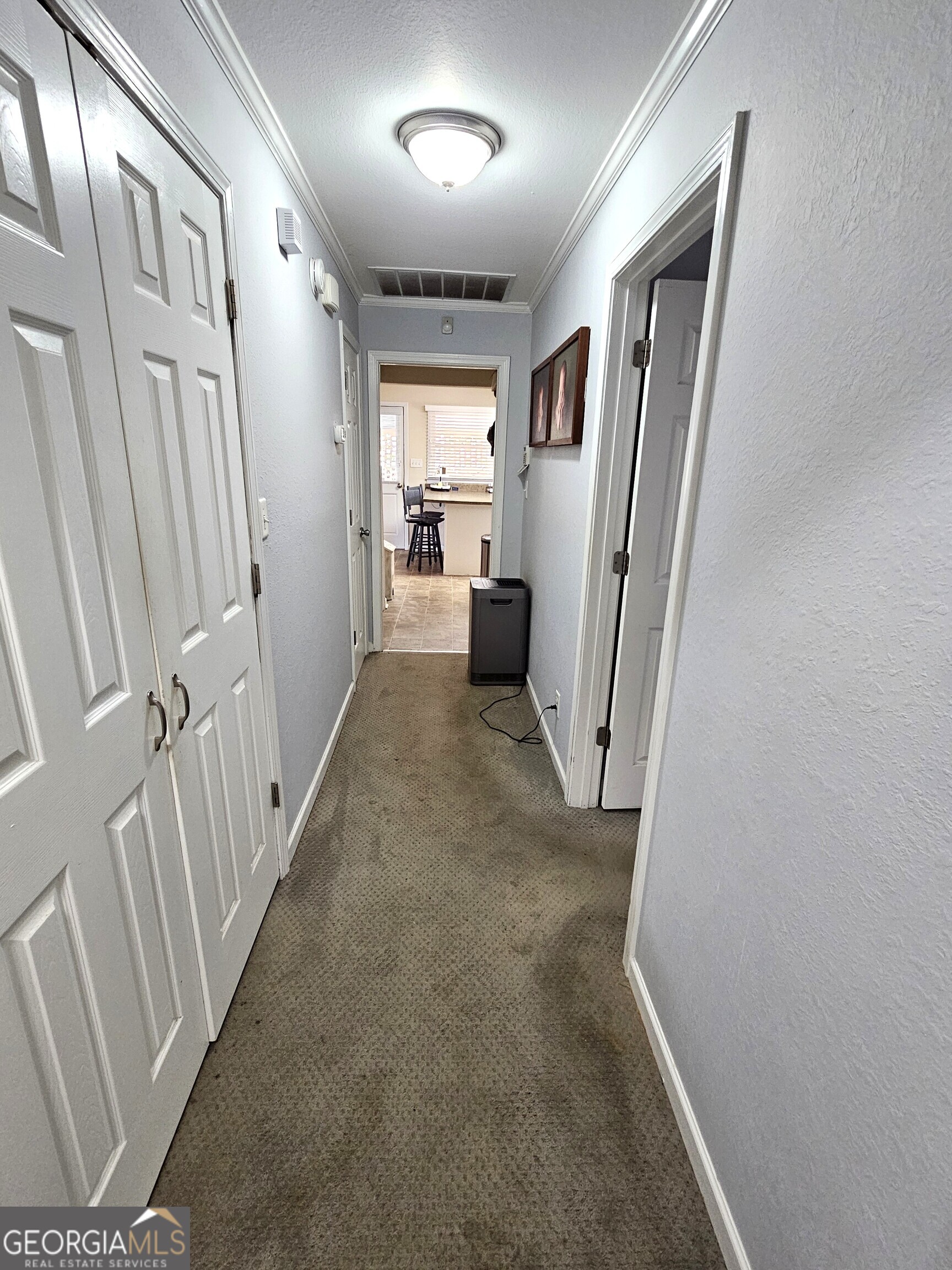 1853 Highway 441 Dublin, GA 31021 - Photo 9 of 28 a view of a hallway with wooden floor and staircase