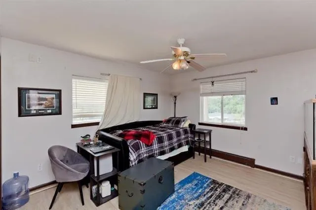 a bedroom with a large bed and a window