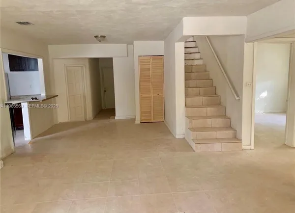 a view of a livingroom with a staircase