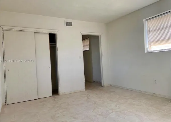 an empty room with closet