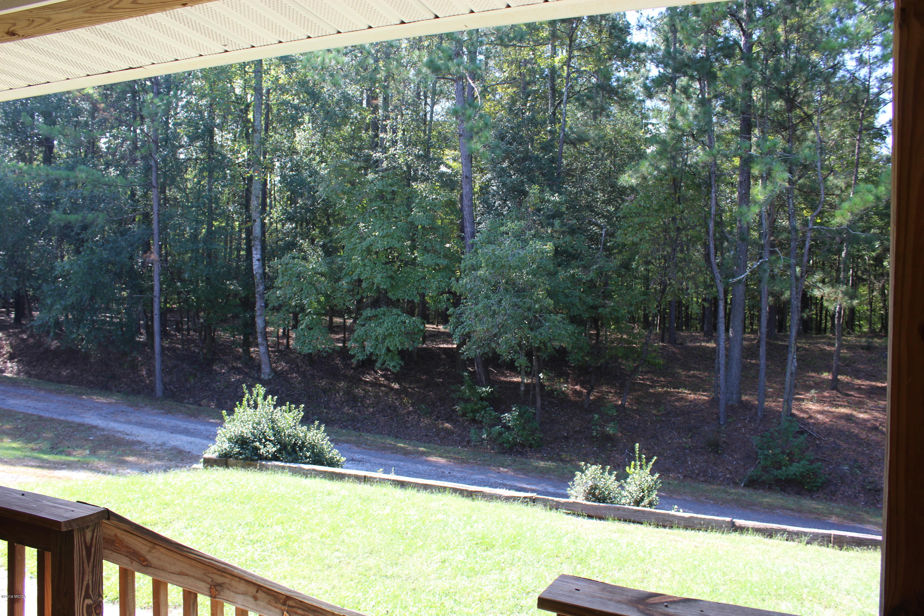 1888 Boxankle Road Forsyth, GA 31029 - Photo 5 of 6 a view of a swimming pool and trees in the background