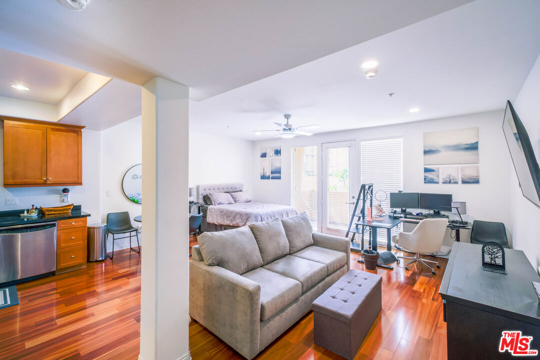 360 West Ave 26, Unit 111 Los Angeles, CA 90031 - Photo 1 of 13 a living room with furniture and a wooden floor