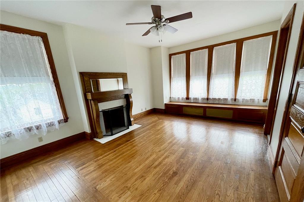 403 Laughlin Street Dawson, PA 15428 - Photo 13 of 39 a view of livingroom with hardwood floor and a fireplace