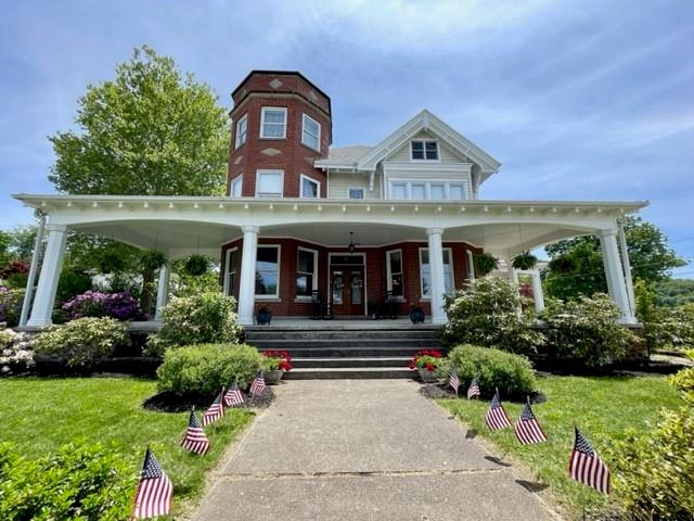 403 Laughlin Street Dawson, PA 15428 - Photo 2 of 39 a front view of a house with garden