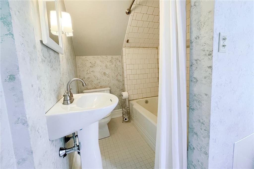 403 Laughlin Street Dawson, PA 15428 - Photo 26 of 39 a bathroom with a sink a toilet and shower
