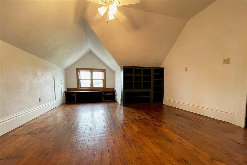 403 Laughlin Street Dawson, PA 15428 - Photo 30 of 39 an empty room with wooden floor and windows