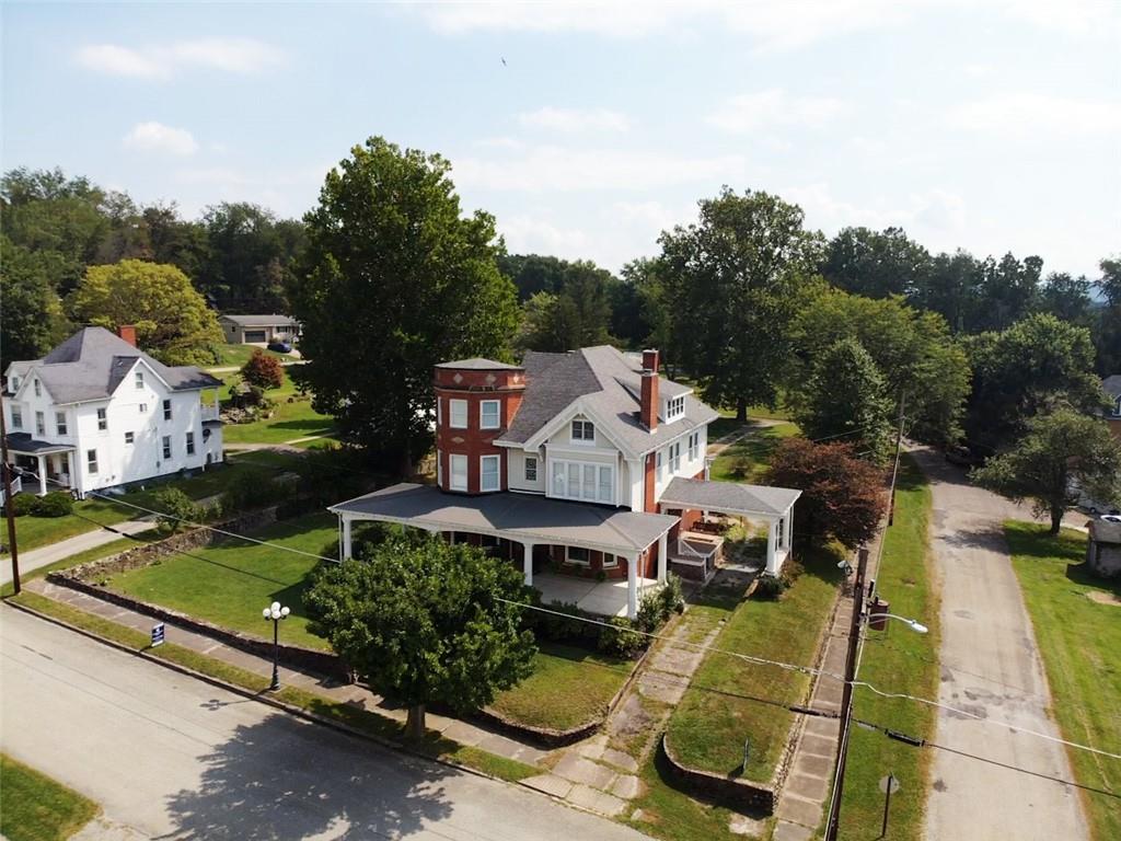 403 Laughlin Street Dawson, PA 15428 - Photo 35 of 39 an aerial view of a house with swimming pool and a yard