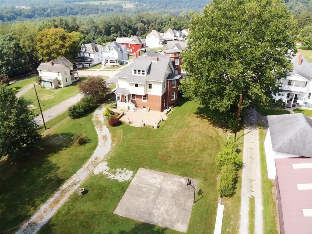 403 Laughlin Street Dawson, PA 15428 - Photo 38 of 39 an aerial view of a house with a yard basket ball court and outdoor seating