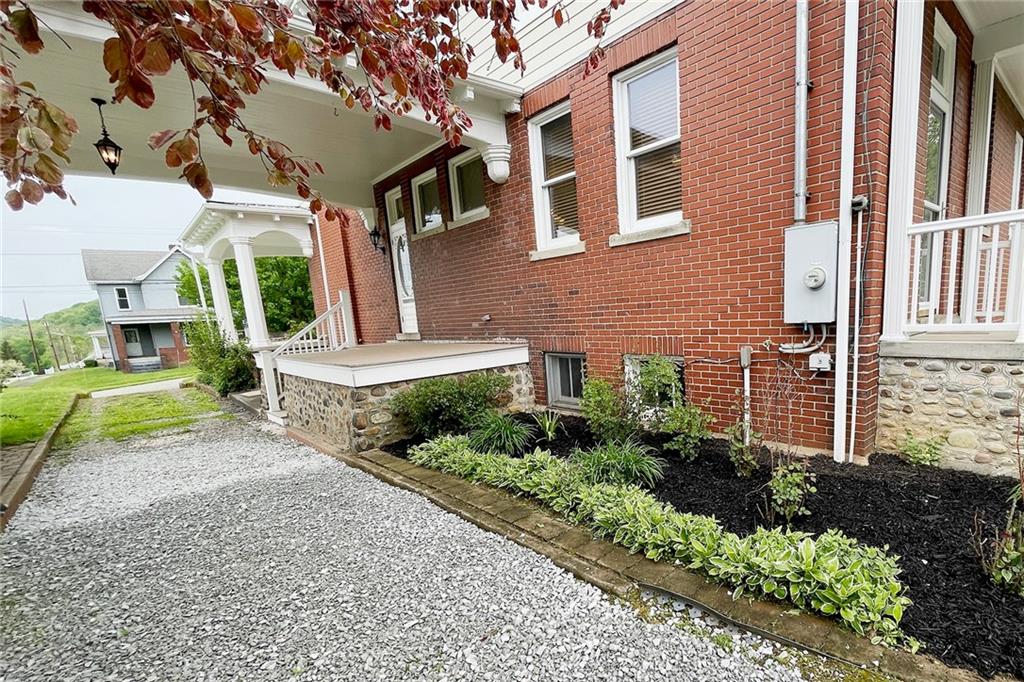 403 Laughlin Street Dawson, PA 15428 - Photo 6 of 39 a front view of a house with a yard and outdoor seating