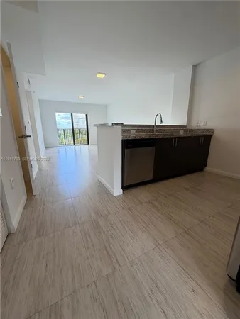 a room with wooden floors and pool table