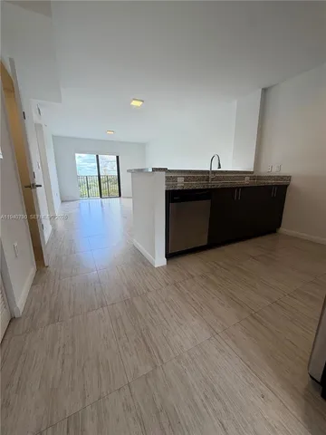 a room with wooden floors and pool table