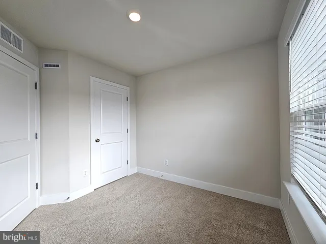 a view of empty room with an empty room