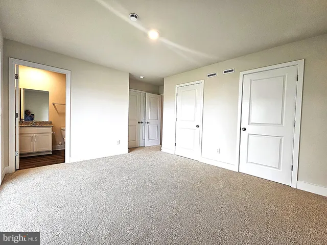 a front view of a house with glass windows