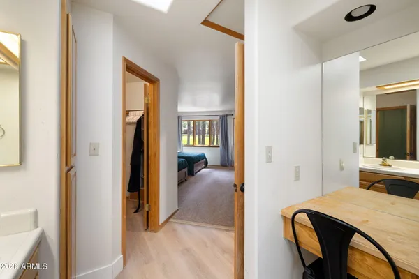 a view of a bedroom from a hallway