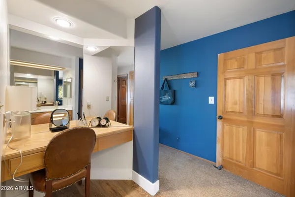 a view of a livingroom with furniture and front door