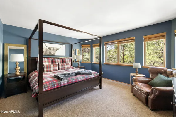 a bed room with a bed and a couch