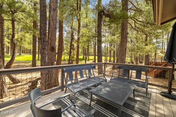 a view of a balcony with chairs
