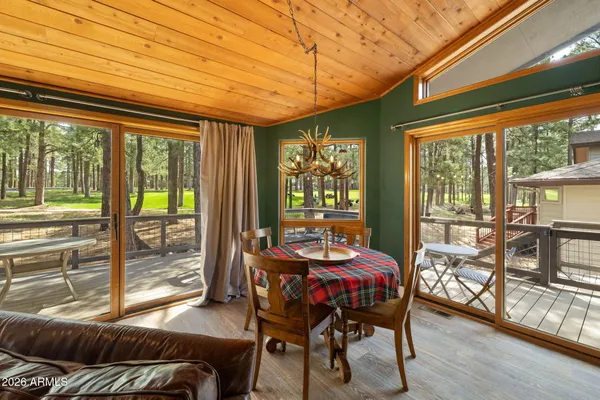 a balcony with furniture and wooden floor