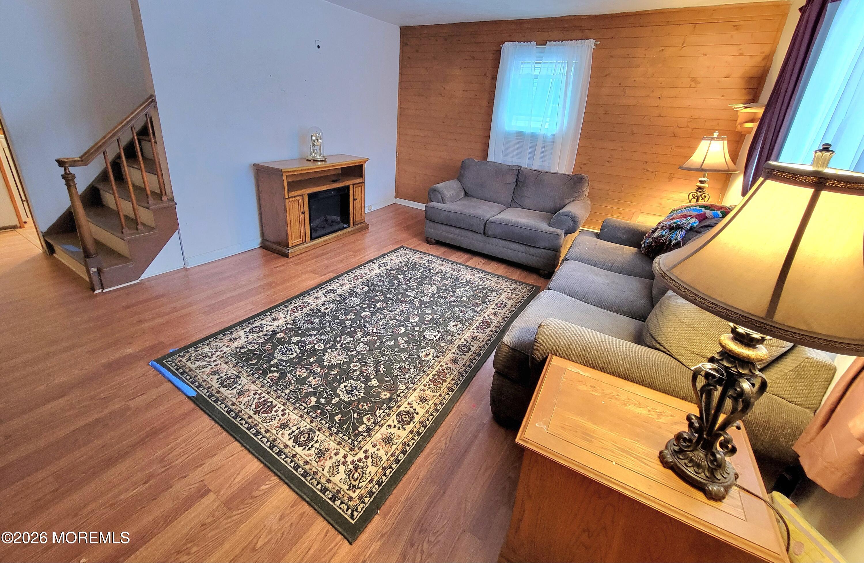 6 Octavia Place Keyport, NJ 07735 - Photo 2 of 9 a living room with furniture and a fireplace