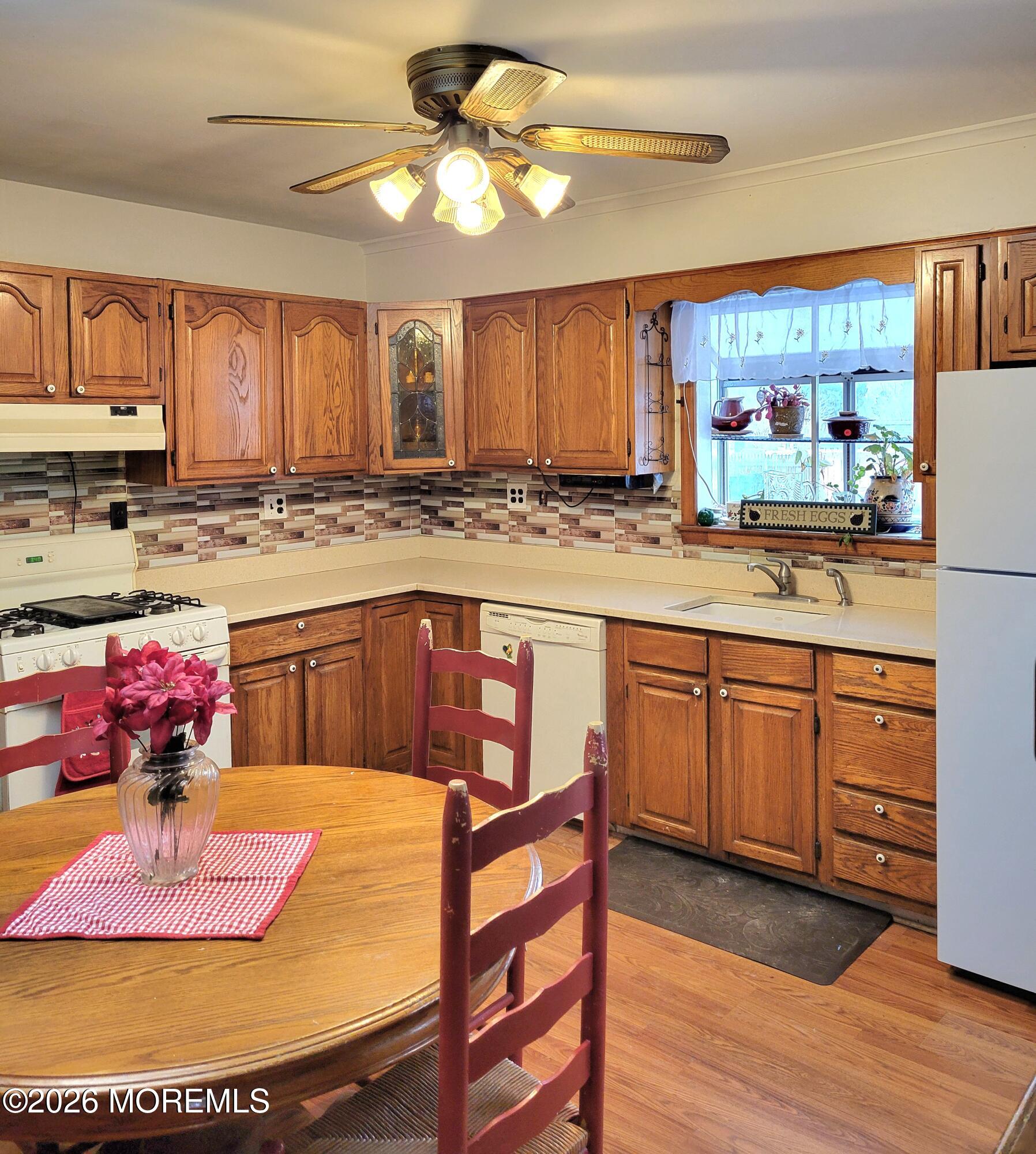 6 Octavia Place Keyport, NJ 07735 - Photo 4 of 9 a kitchen with cabinets and wooden floor