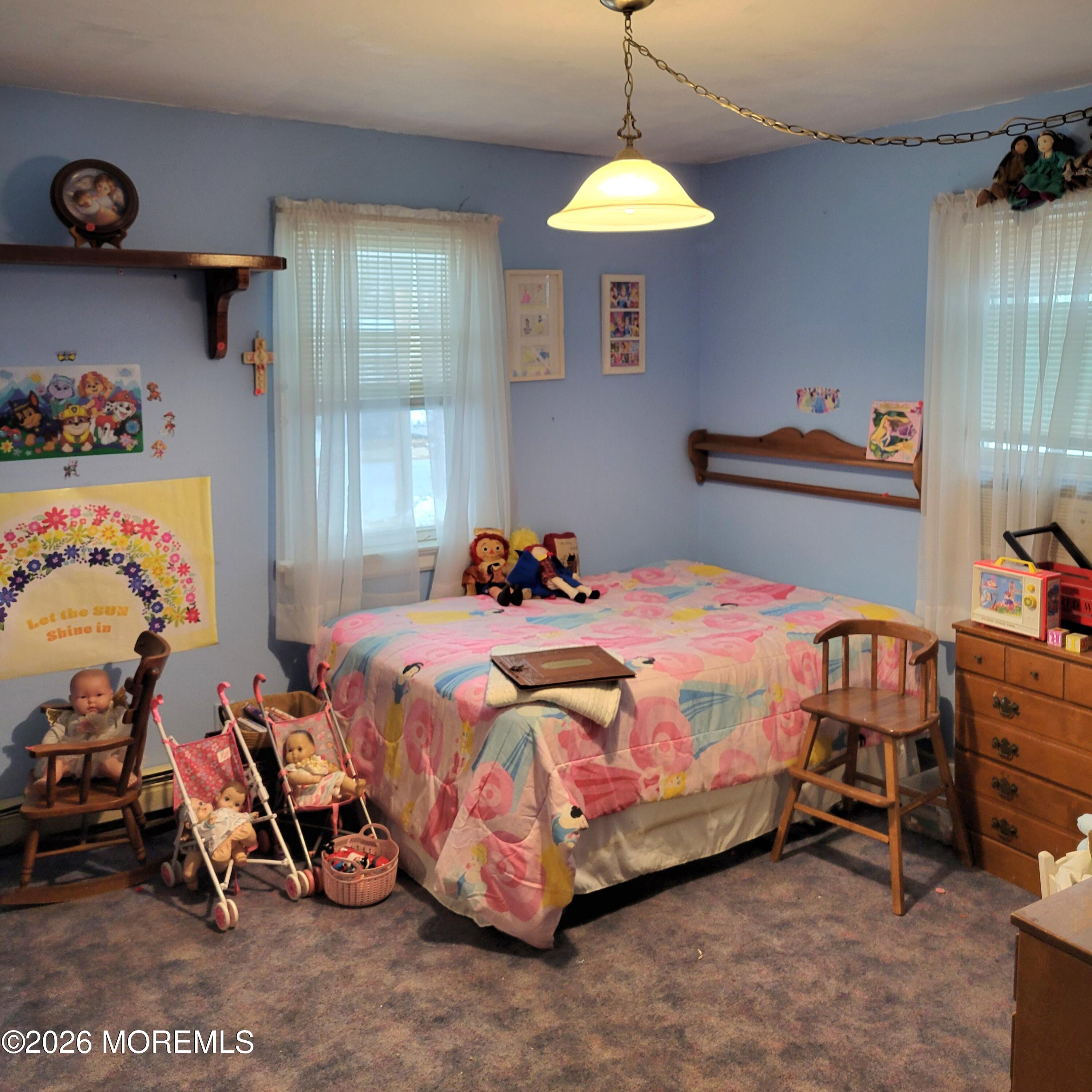 6 Octavia Place Keyport, NJ 07735 - Photo 5 of 9 a bedroom with a bed and a table in it