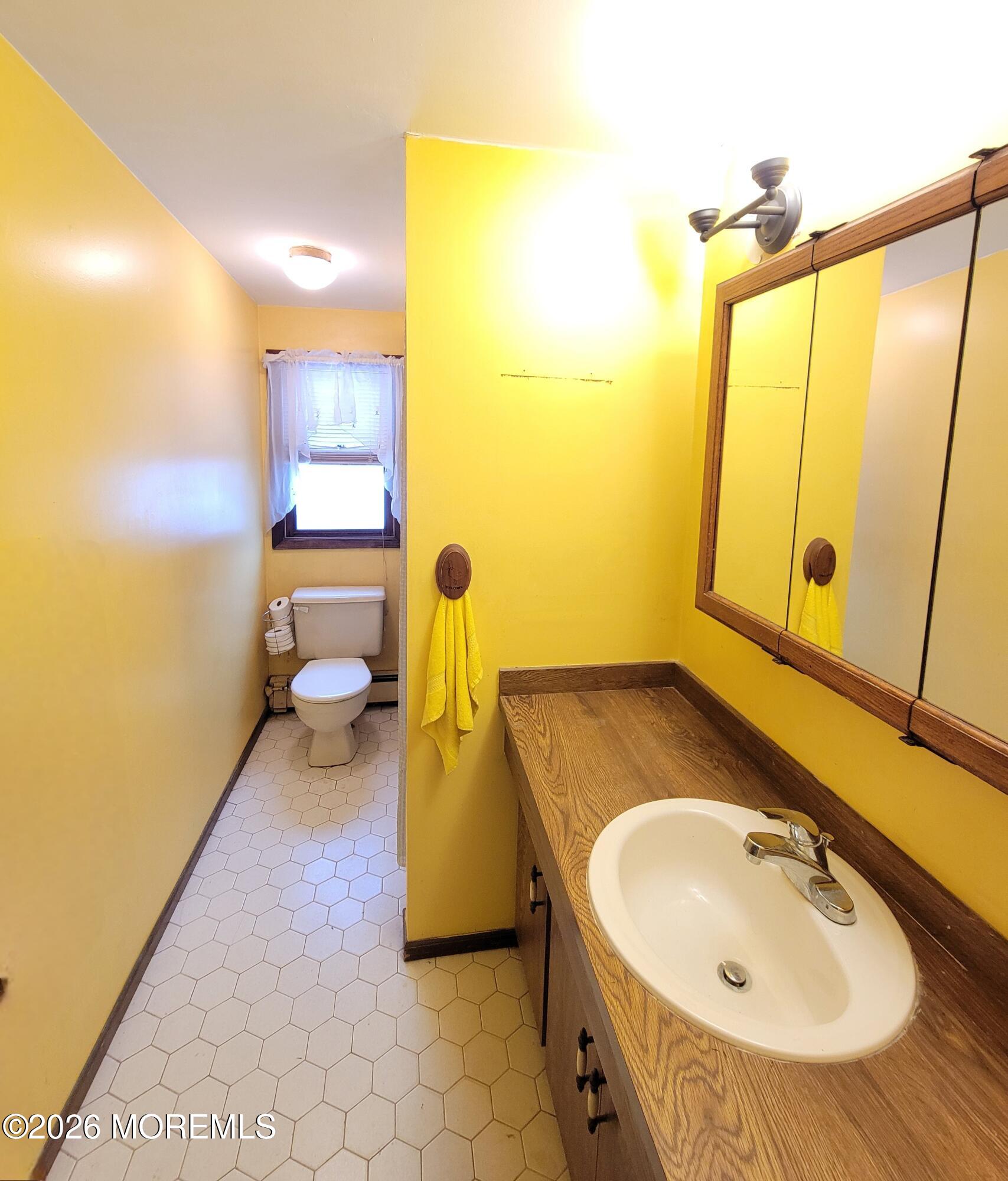 6 Octavia Place Keyport, NJ 07735 - Photo 8 of 9 a bathroom with a sink and a mirror