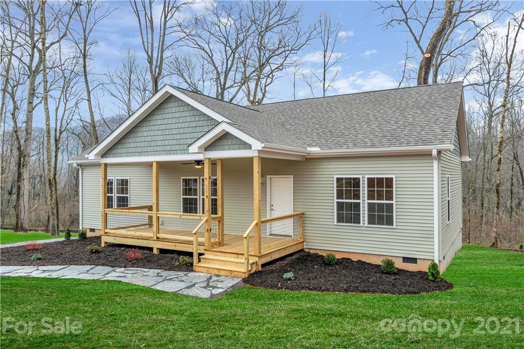 357 Ridge View Drive, Unit 4 Clyde, NC 28721 - Photo 2 of 20 a view of a house with a yard