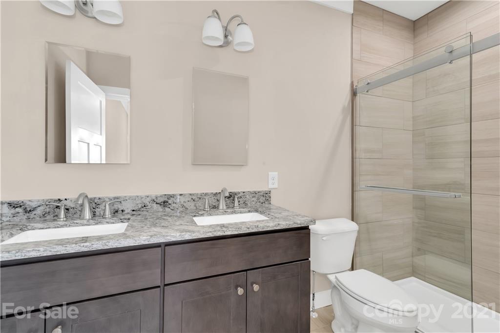 357 Ridge View Drive, Unit 4 Clyde, NC 28721 - Photo 14 of 20 a bathroom with a sink toilet and shower
