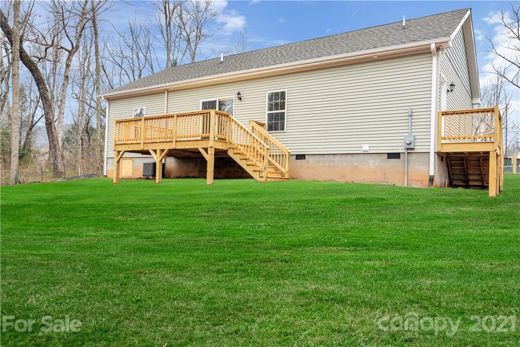 357 Ridge View Drive, Unit 4 Clyde, NC 28721 - Photo 20 of 20 a view of a house with a backyard