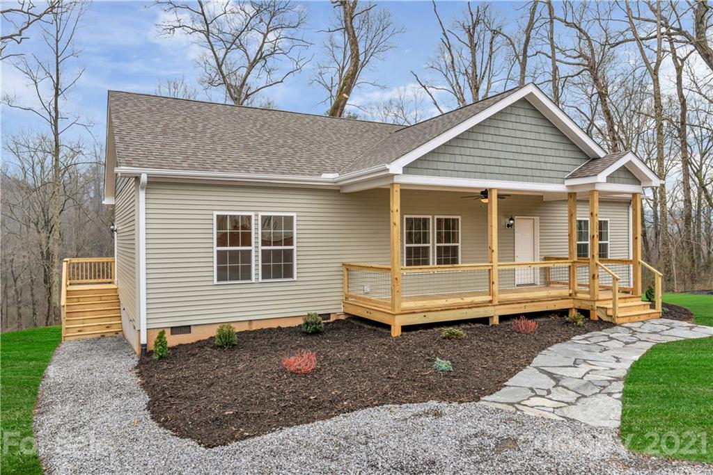 357 Ridge View Drive, Unit 4 Clyde, NC 28721 - Photo 3 of 20 a front view of a house with a yard