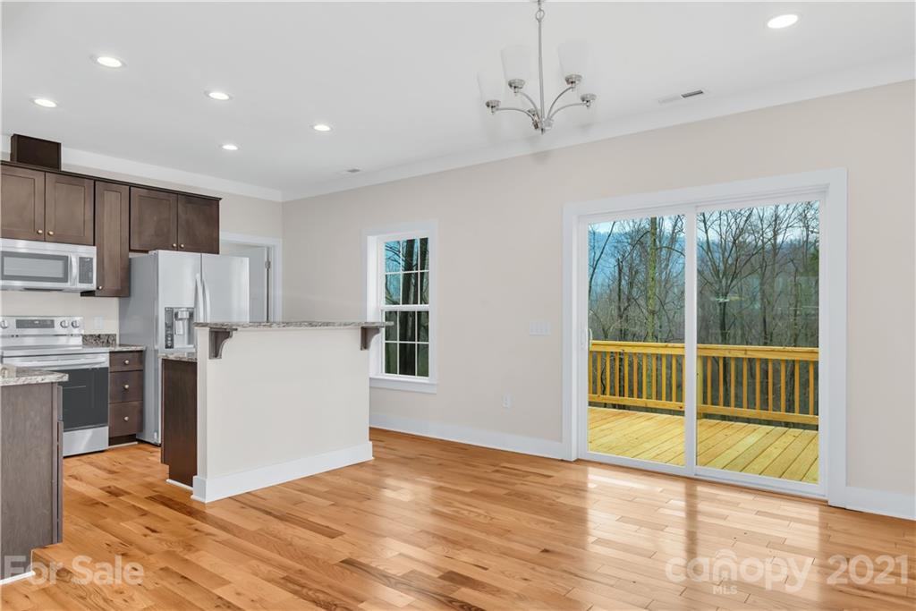 357 Ridge View Drive, Unit 4 Clyde, NC 28721 - Photo 6 of 20 a view of kitchen with furniture and refrigerator