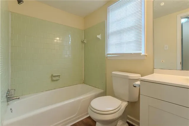 a bathroom with a sink toilet and bathtub