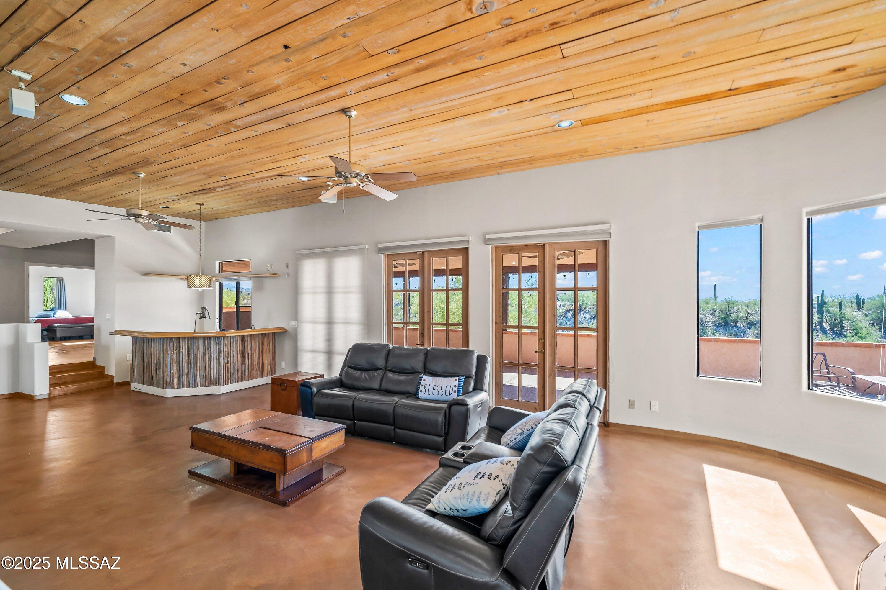 30 West Stone Loop Tucson, AZ 85704 - Photo 5 of 26 a living room with furniture and a large window