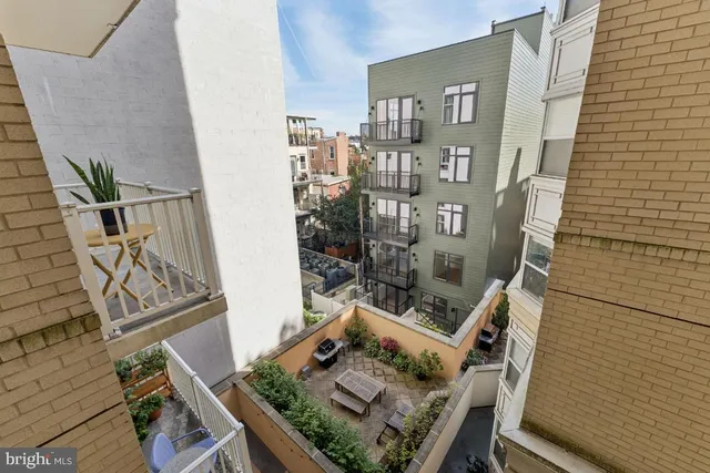 a view of a balcony with furniture